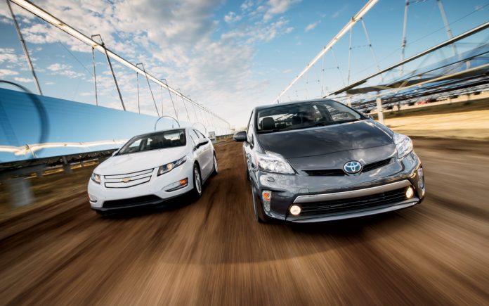 2012-Chevrolet-Volt-2012-Toyota-Prius-Plug-in-front-end-in-motion