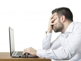 How to recover lost data using EaseUS Data Recovery Wizard Frustrated man in front of a laptop.
