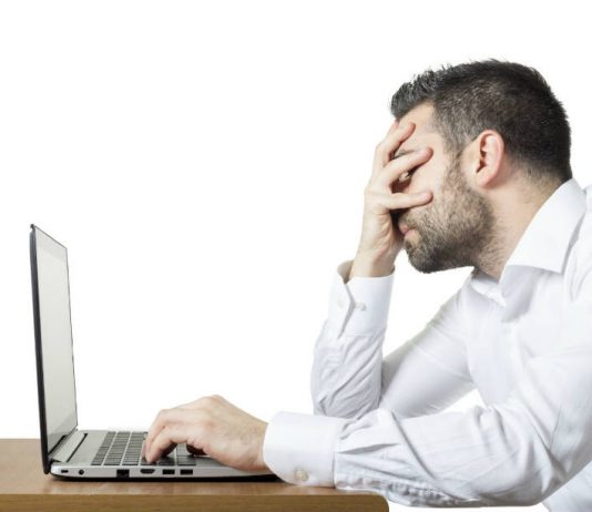 How to recover lost data using EaseUS Data Recovery Wizard Frustrated man in front of a laptop.