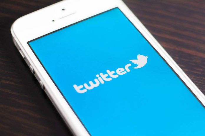 Twitter, Twitter Highlights, social media Smartphone with Twitter on the screen