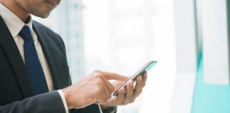 Man Working on Mobile Phone