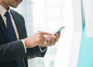 Man Working on Mobile Phone