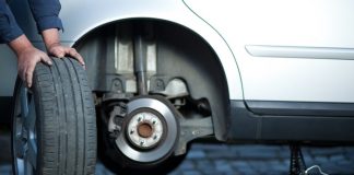 Mechanic Changing Old Tire