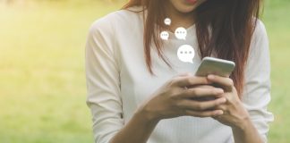 Woman Using Live Chat on Mobile Phone