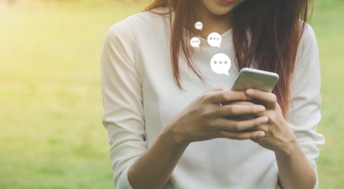 woman-live-chat-mobile-phone Woman Using Live Chat on Mobile Phone