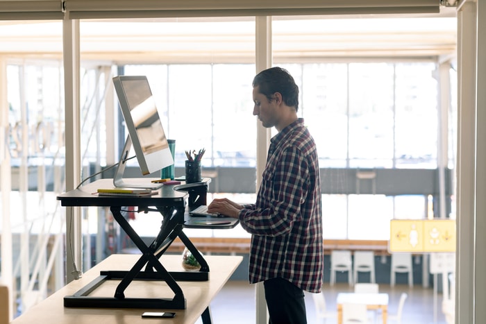 Employee Working on Standing Desk