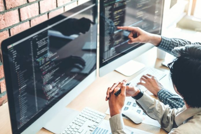 software-developer-writing-code Software Developer Writing Code