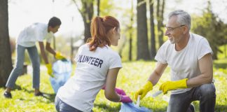 Two Volunteers Picking Up Garbage
